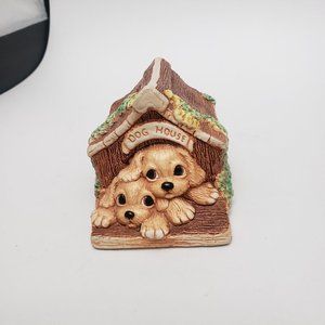 Dogs in a doghouse figurine